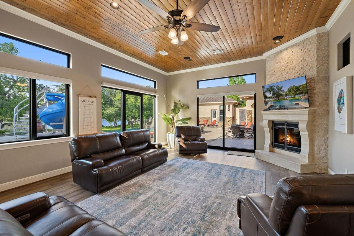 Living room with couches and a fireplace.