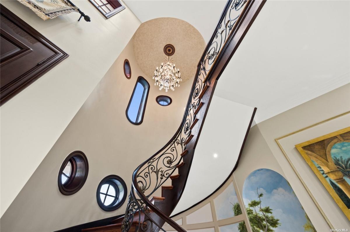 Stairs with a chandelier.