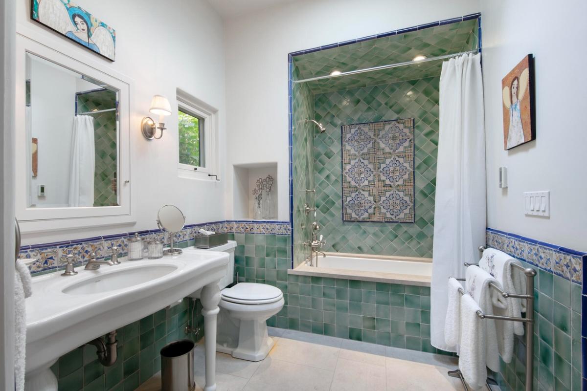 Bathroom with a sink, toilet and a shower.