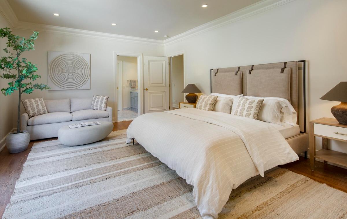 Bedroom with a private living space.