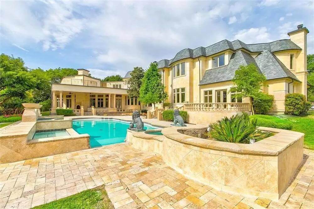 elegant backyard with luxurious pool and spa
