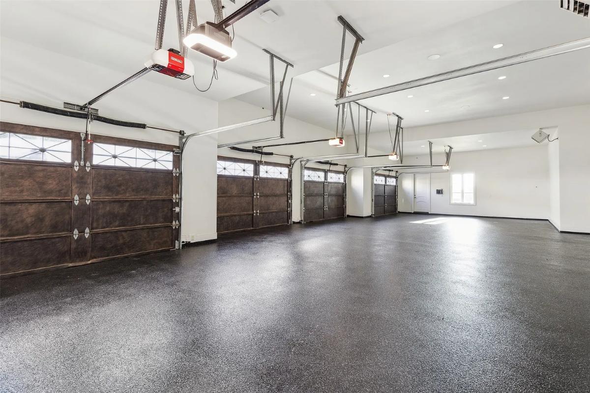 Spacious garage with an automatic door opener.