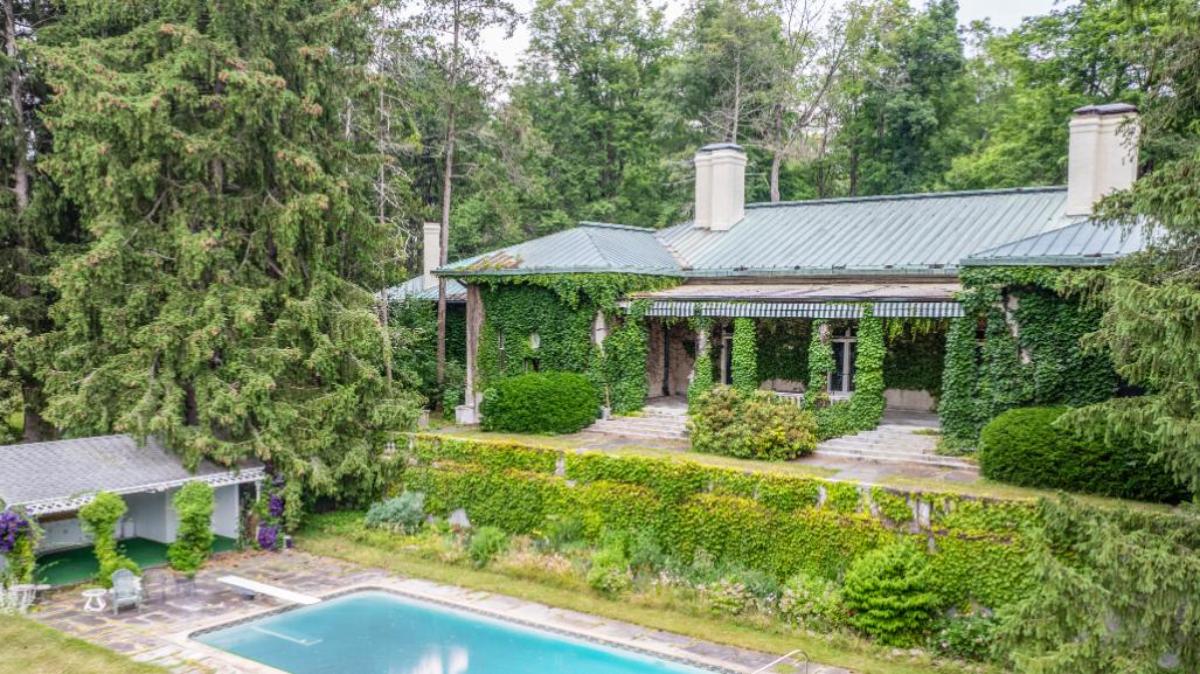 Secondary home that sits above the pool.