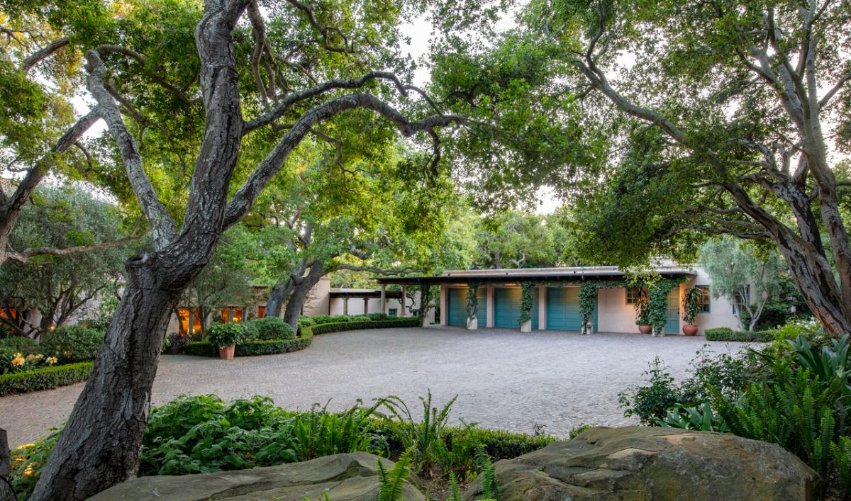 Garage with a spacious driveway.