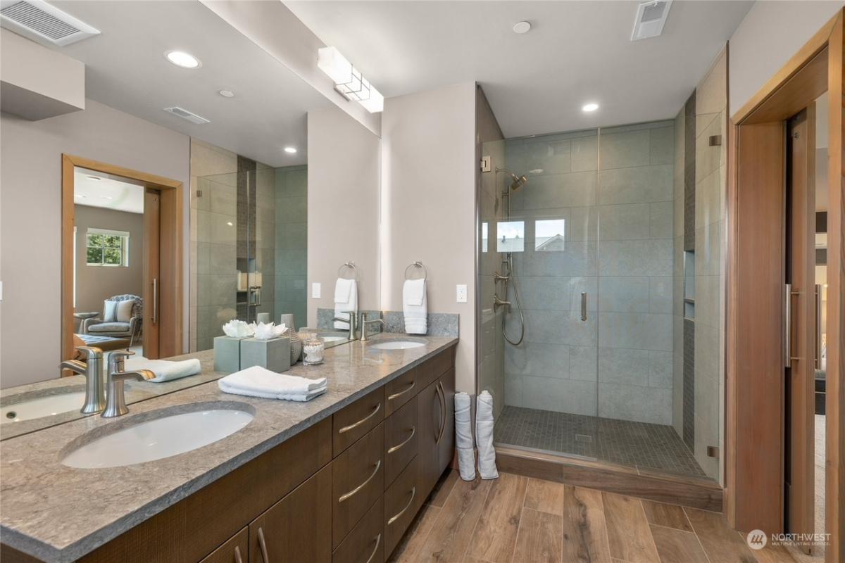 Bathroom with a custom-made vanity and a walk-in shower.