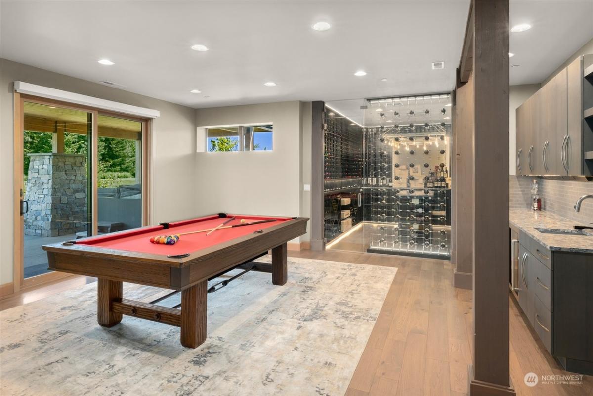 Recreation room with a billiards table.