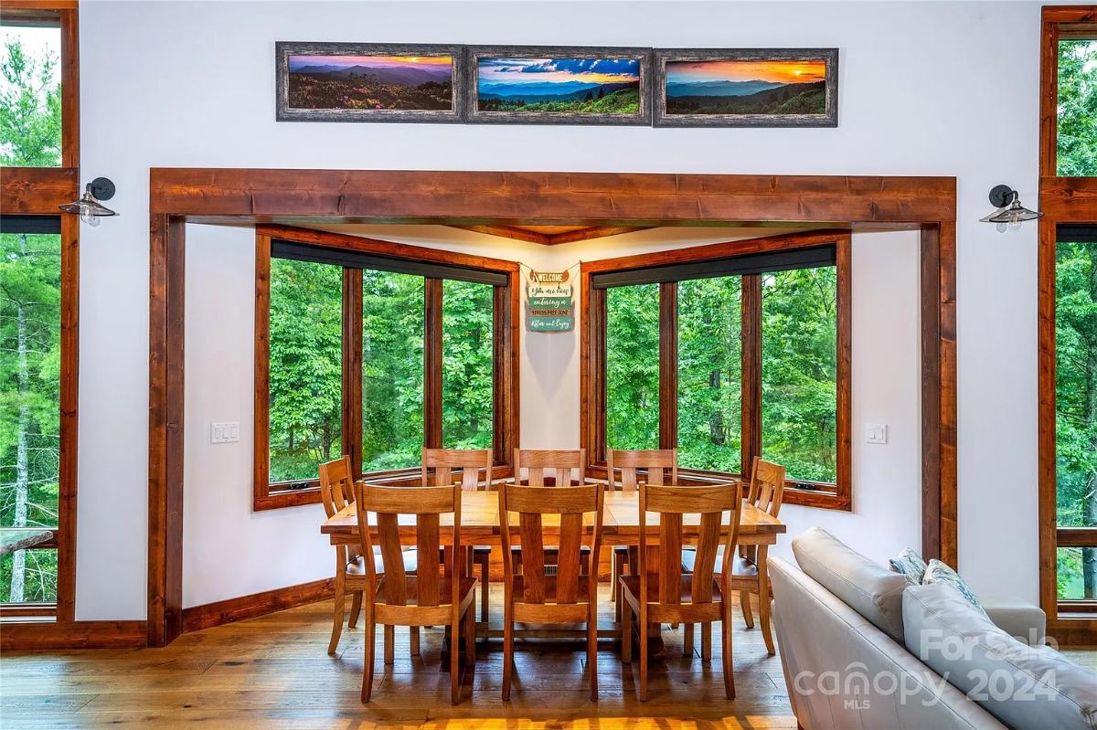 Dining room with a large wood table and chairs.