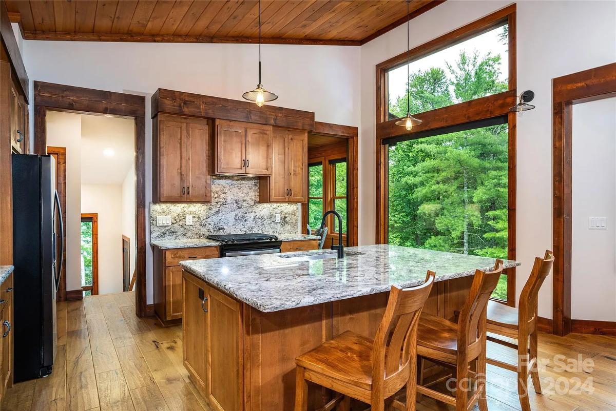 Kitchen with custom cabinetry and a counter breakfast bar.