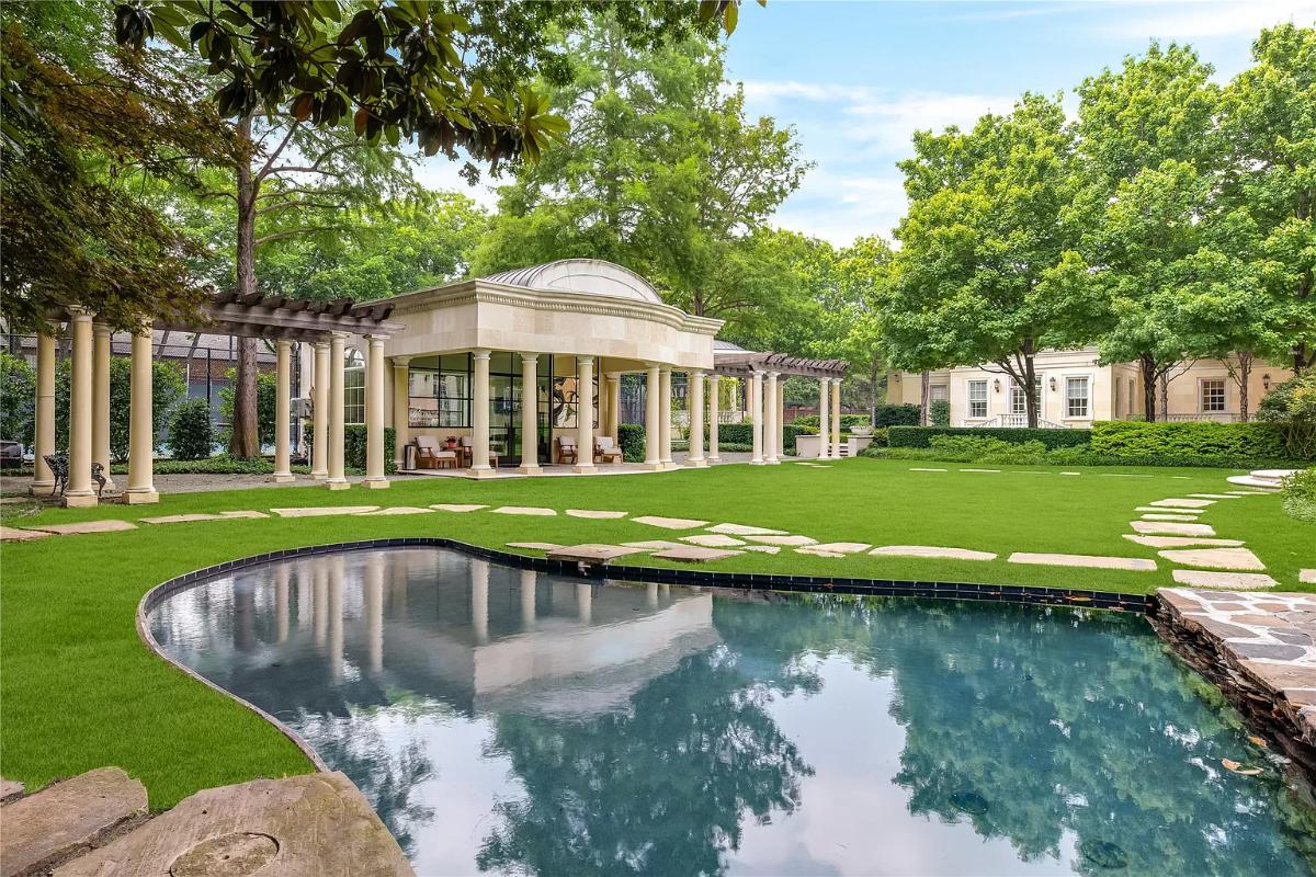 Pool with a cabana and pergolas.