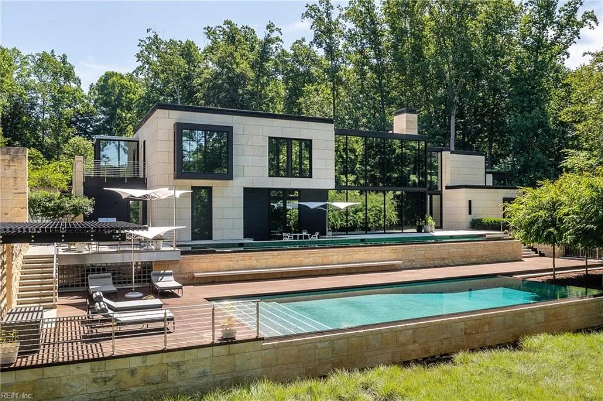 Rear view of the mansion with a pool.