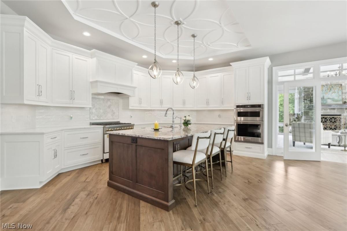 Kitchen with custom cabinetry, and a counter breakfast bar.