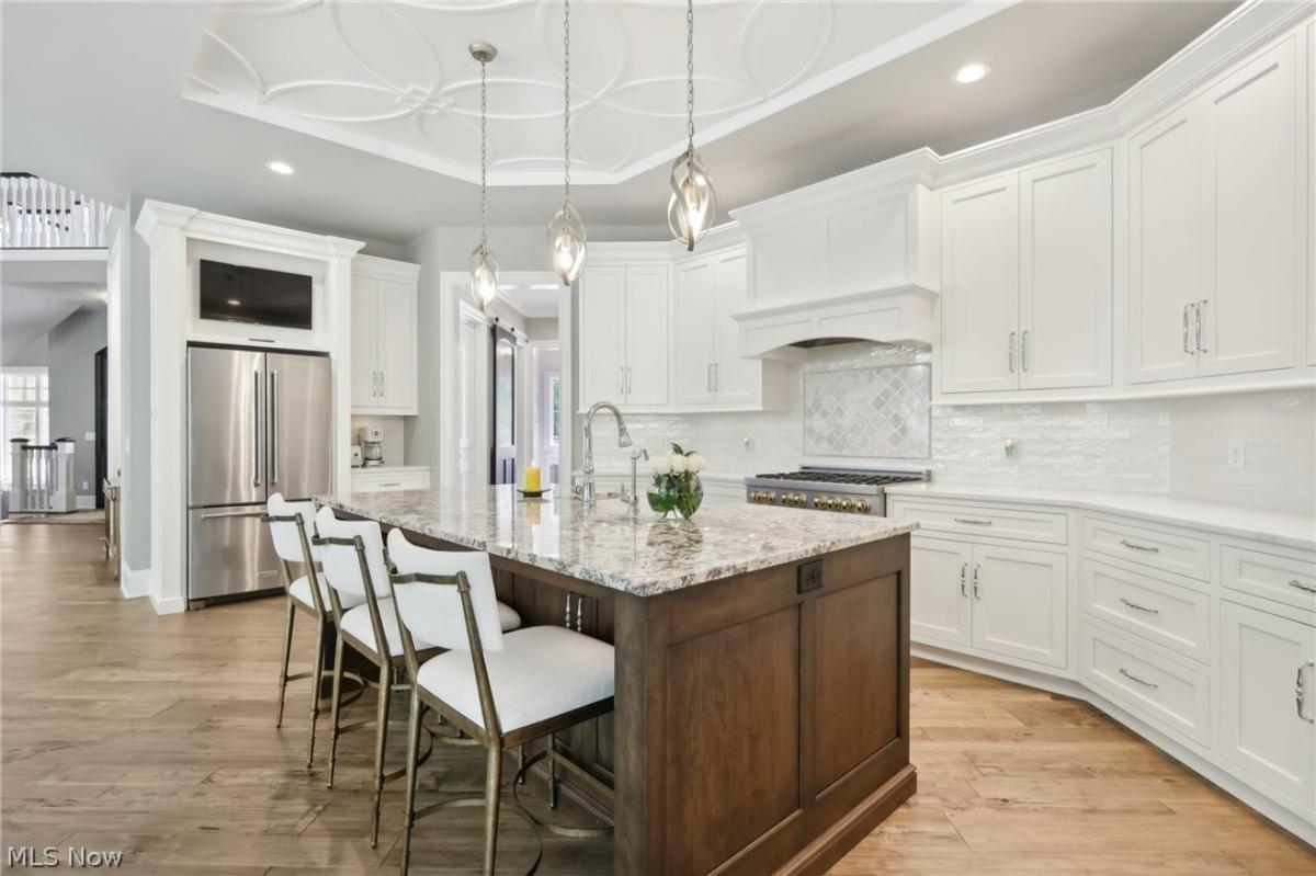 Kitchen with custom cabinetry, and a counter breakfast bar.