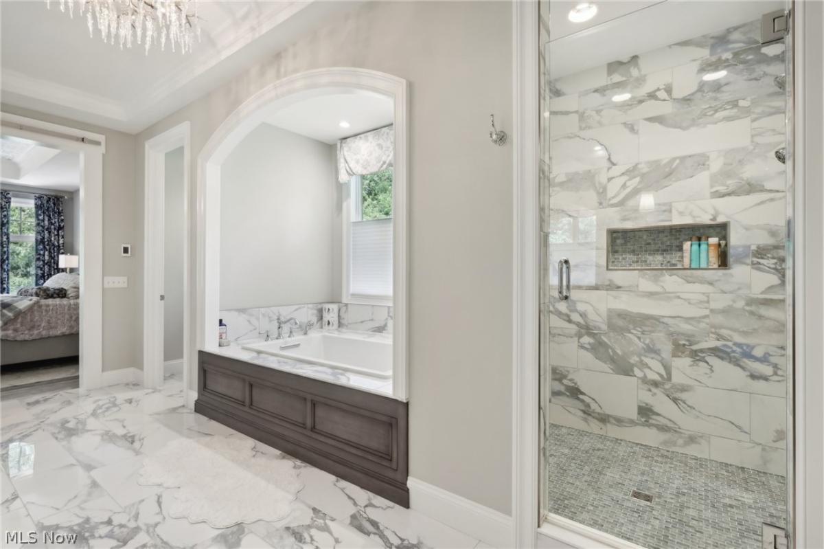 Bathroom with a soaking tub and a walk-in shower.