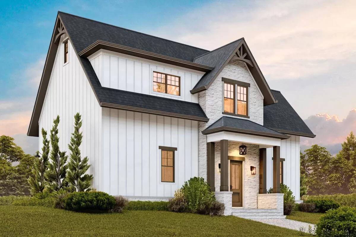 Front view with board and batten siding, and a covered entry supported by stone base pillars.