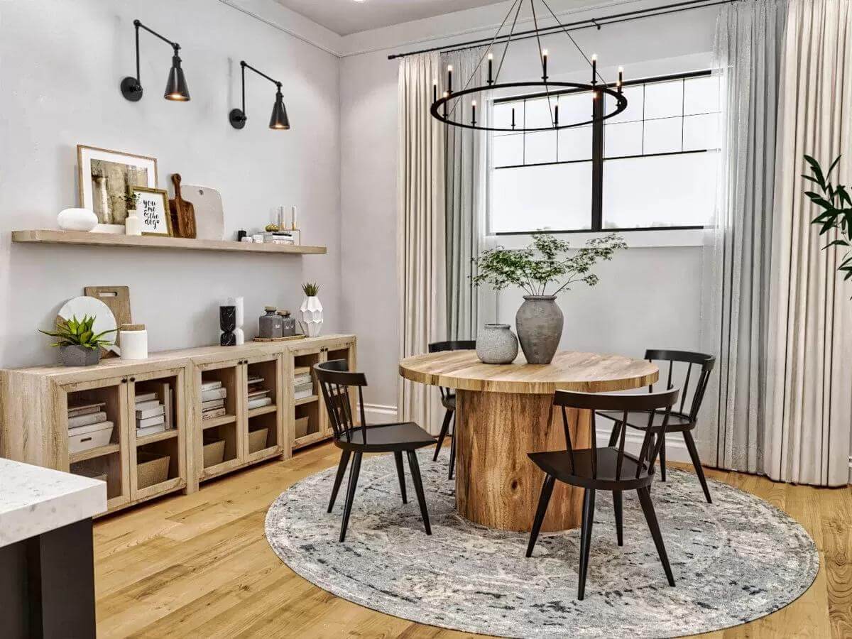Dining area with a round dining set and a rustic cabinet topped by a floating shelf.
