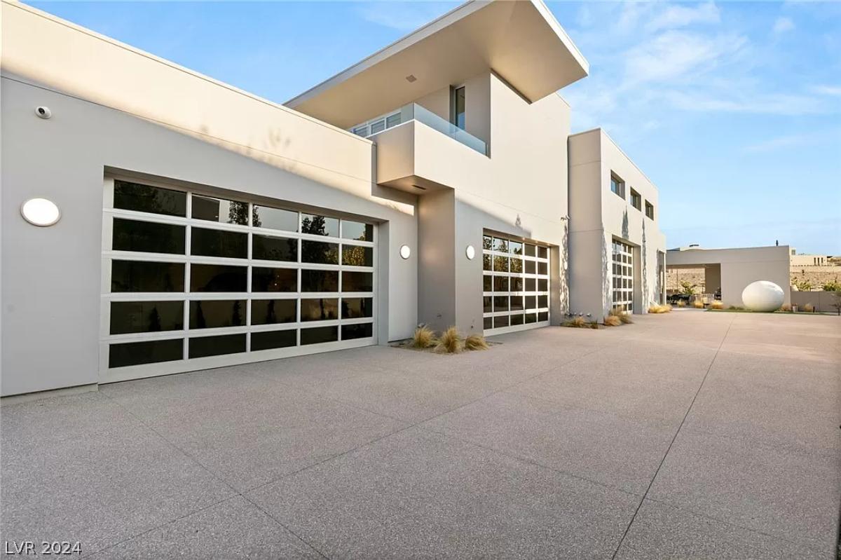 Garage with a spacious driveway.