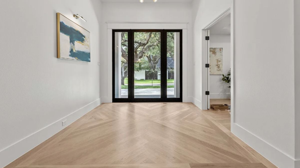 A foyer with a painting.