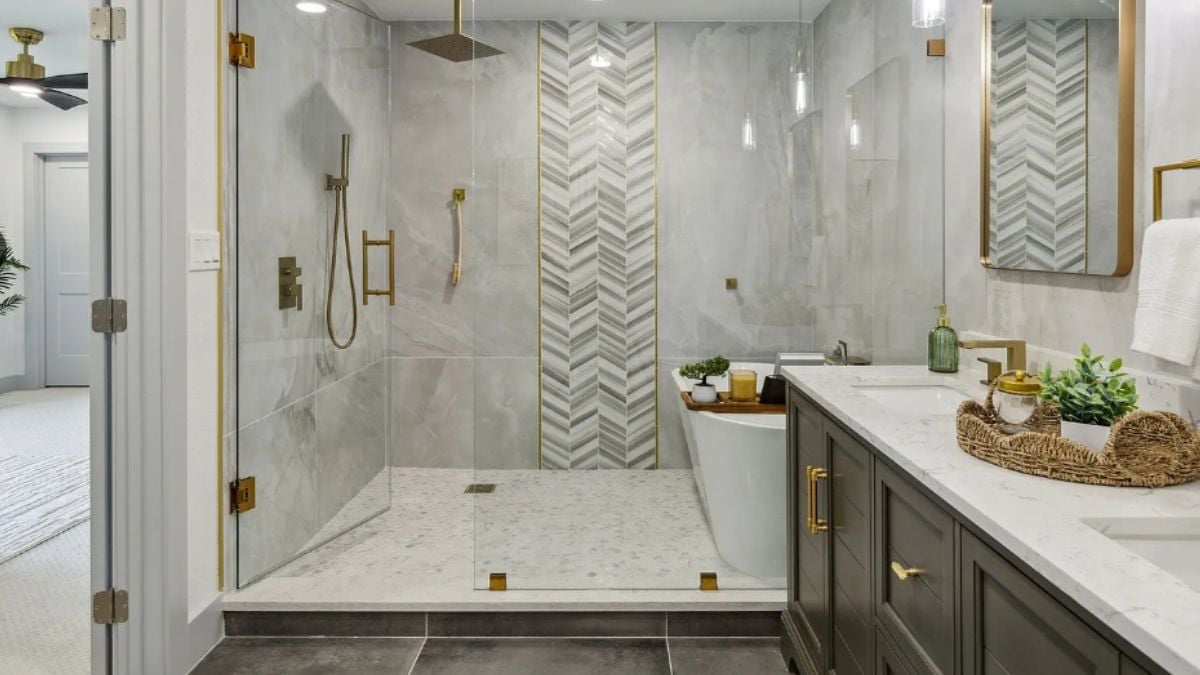 A bathroom with a vanity, a shower, and a bathtub.