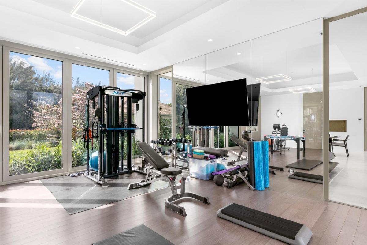 Home gym with huge mirrors.