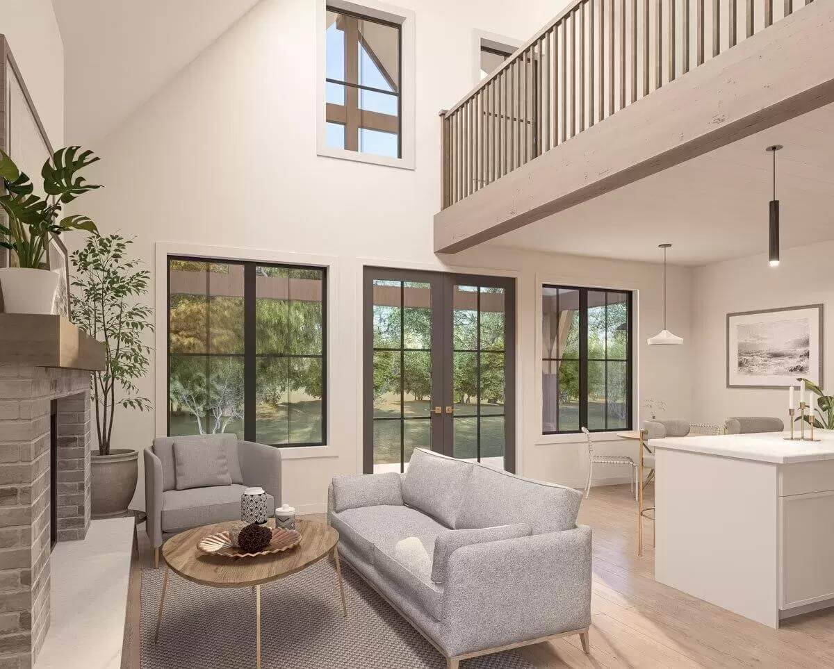 Living room with gray sodas and a wooden coffee table under a vaulted ceiling.