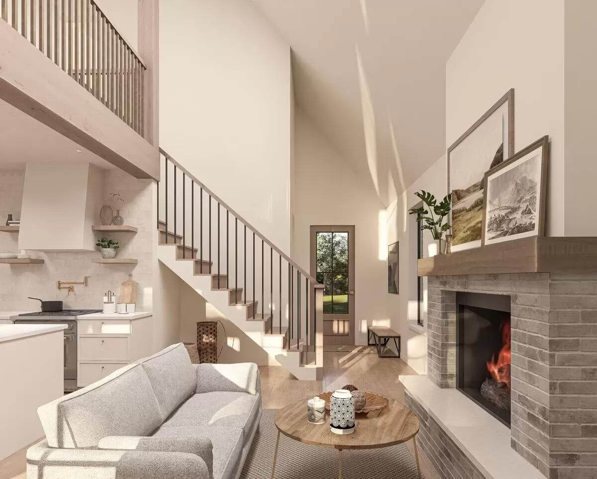 Living room with a brick fireplace topped by framed artworks.