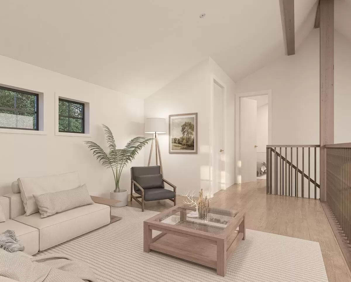 The loft includes a modern sofa and a glass-top coffee table over the striped area rug.