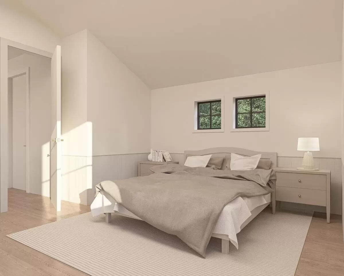Bedroom with light wood nightstands and a matching bed over the area rug.