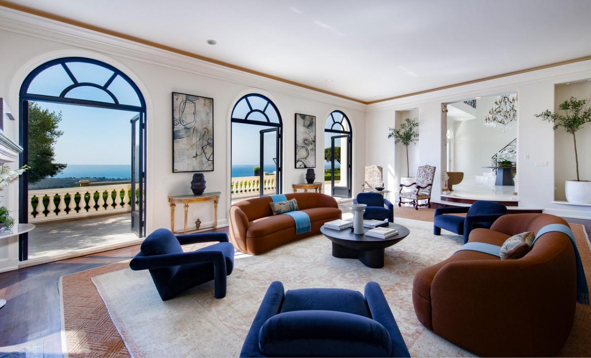 Living room with hardwood floors and glass doors.