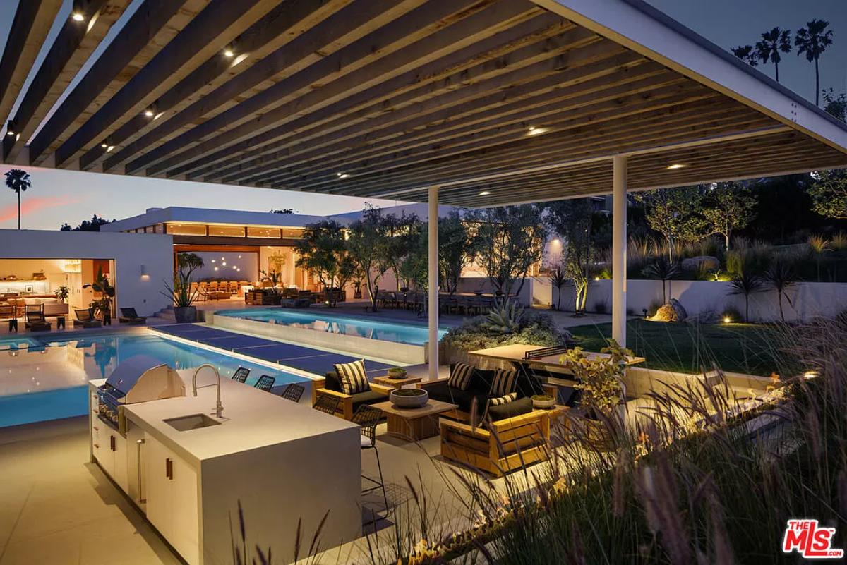 Pergola with a kitchen and a living space.