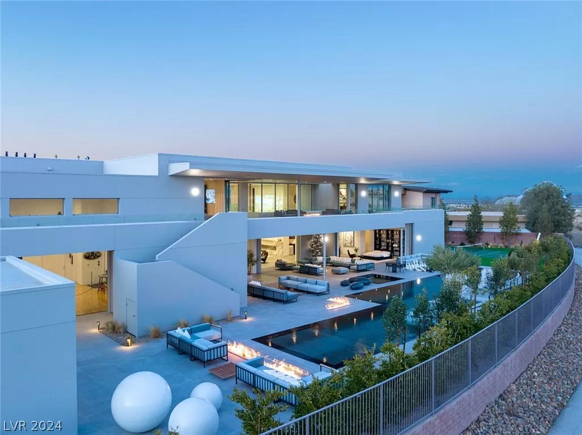 Rear view of the mansion with a pool.