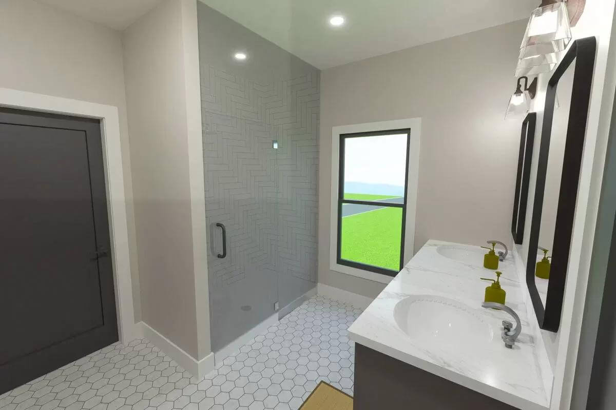 Primary bathroom with a dual sink vanity and a walk-in shower.