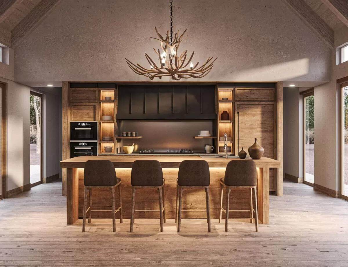 Kitchen with custom cabinetry and a breakfast island illuminated by an antler chandelier.