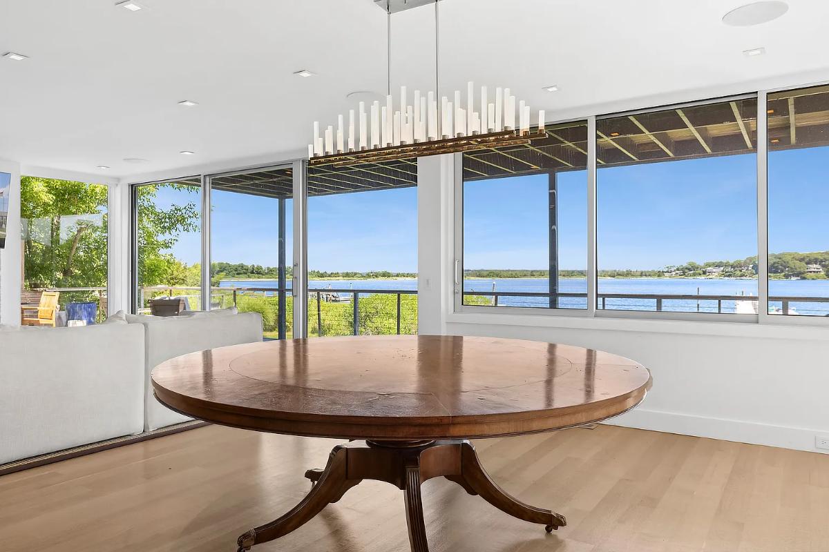 Dining room with a round wood table.