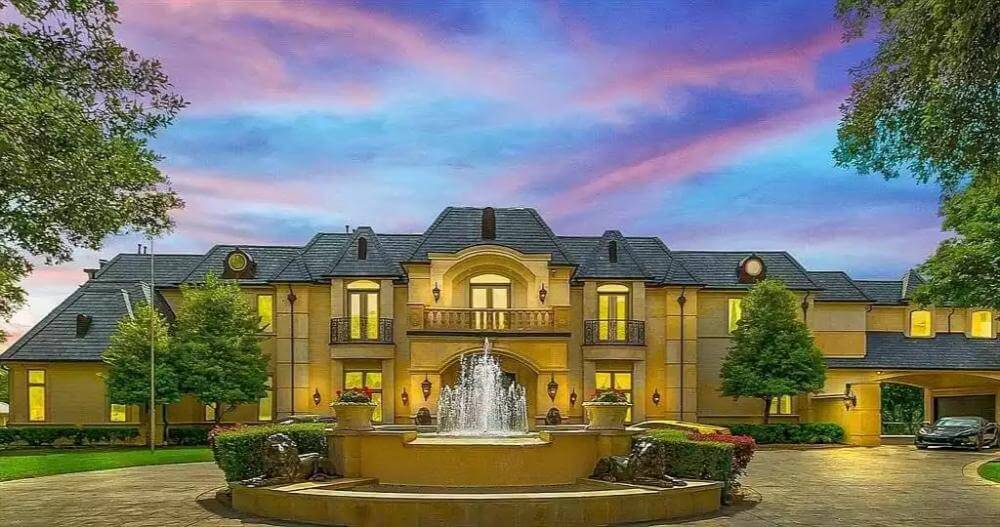 Elegant french chateau-style exterior with fountain