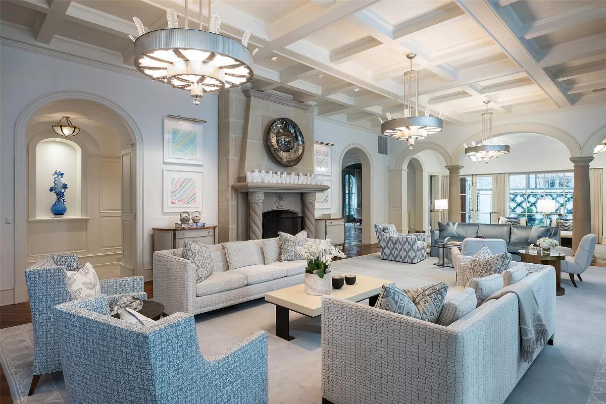 Living room with a fireplace and coffered ceilings.