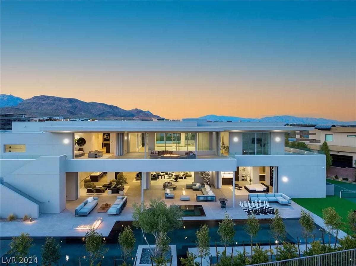 Rear view of the mansion with a pool.