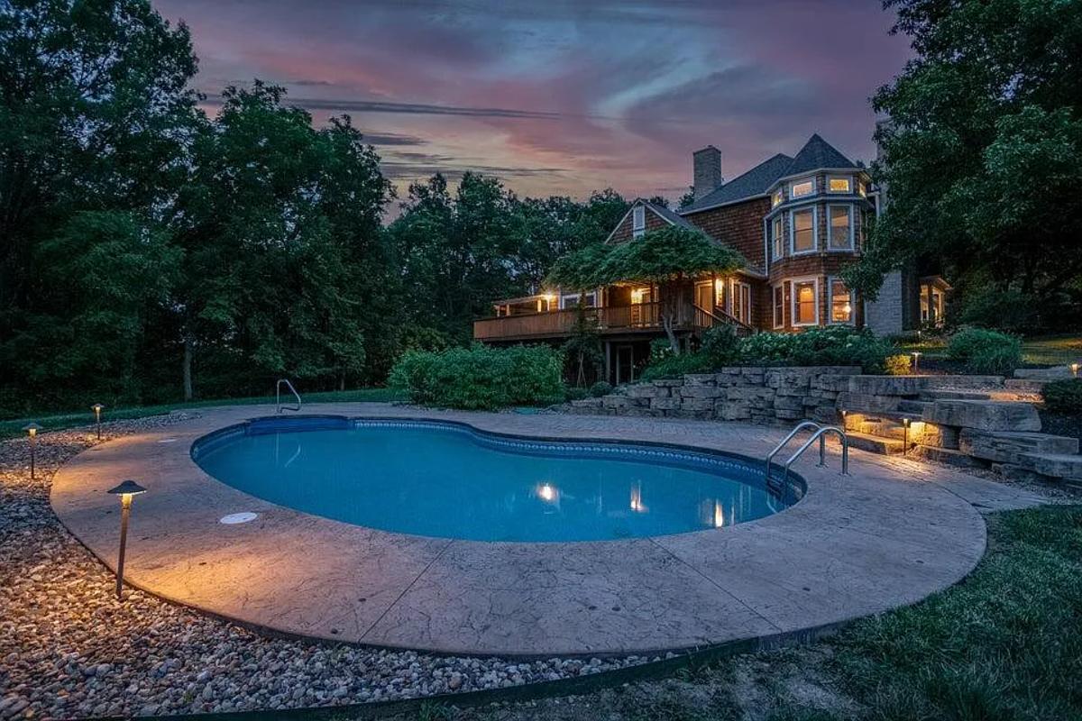 Rear view of the house with a pool.