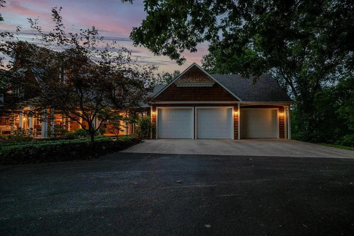Garage with a spacious driveway.