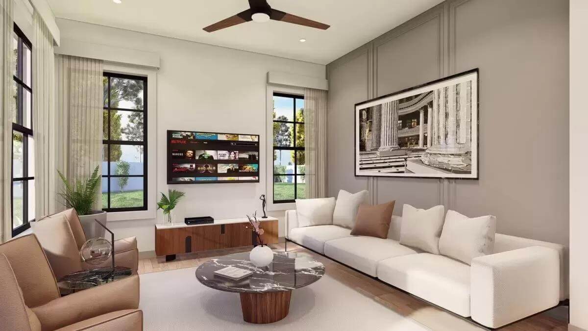 Living room with modern seats, a round coffee table, and a wall-mounted TV.