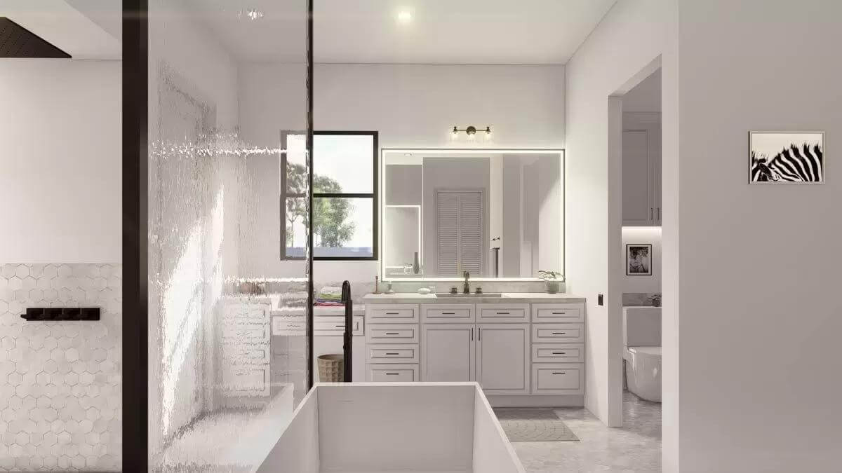 Primary bathroom with a large vanity, a soaking tub, and a glass-enclosed shower.