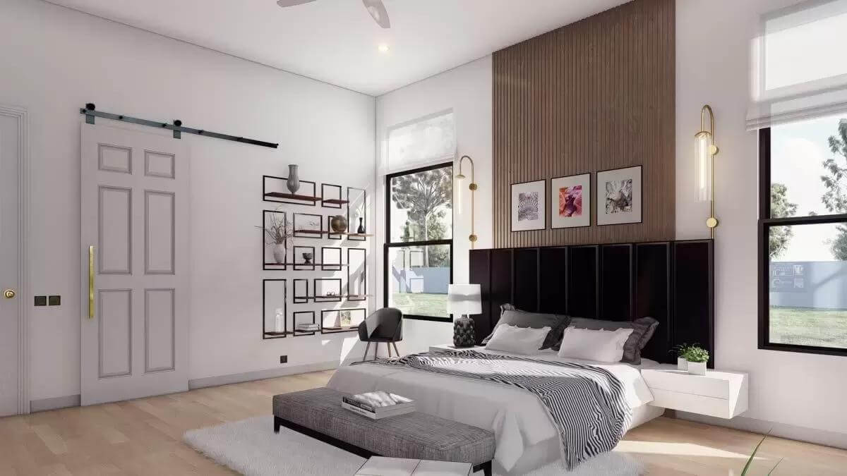 Bedroom with a custom bed and an ensuite bath hidden behind the barn door.