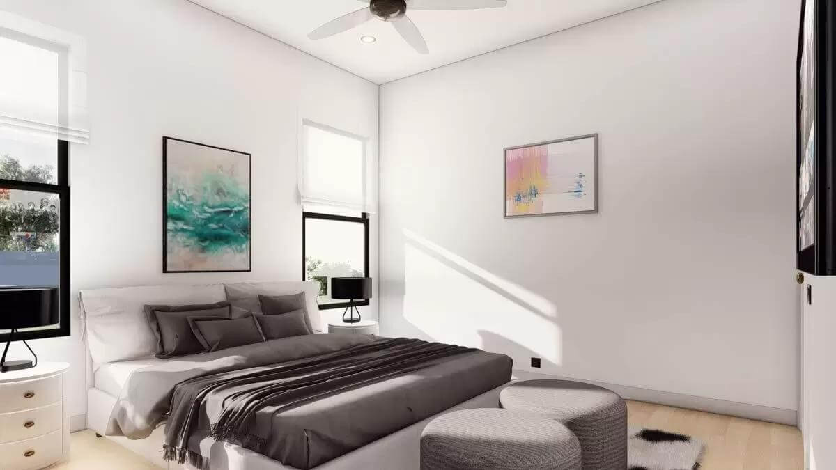 Bedroom with aluminum windows and an upholstered bed complemented by two round stools.