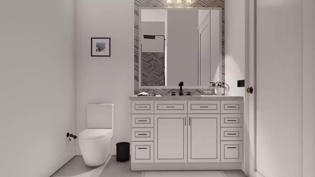 Bathroom with a white vanity and a toilet.