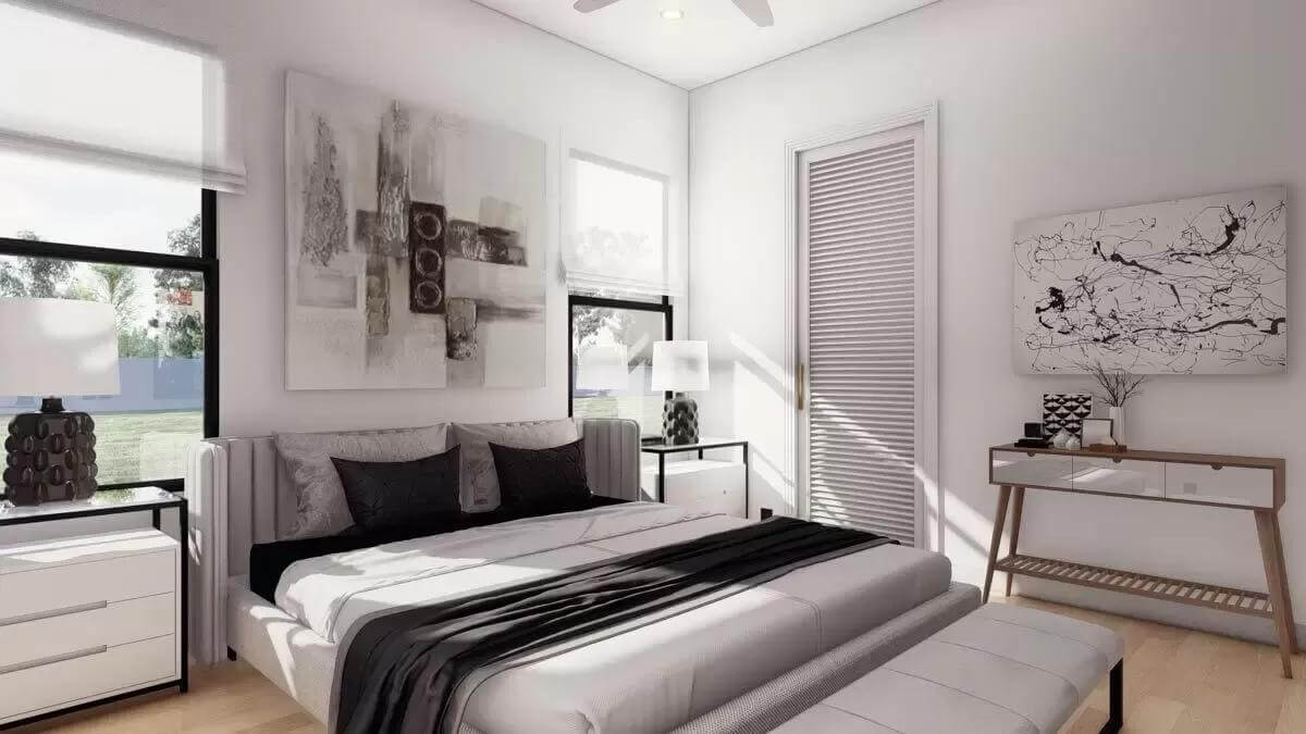 Bedroom with an upholstered bed and a matching bench over the hardwood flooring.