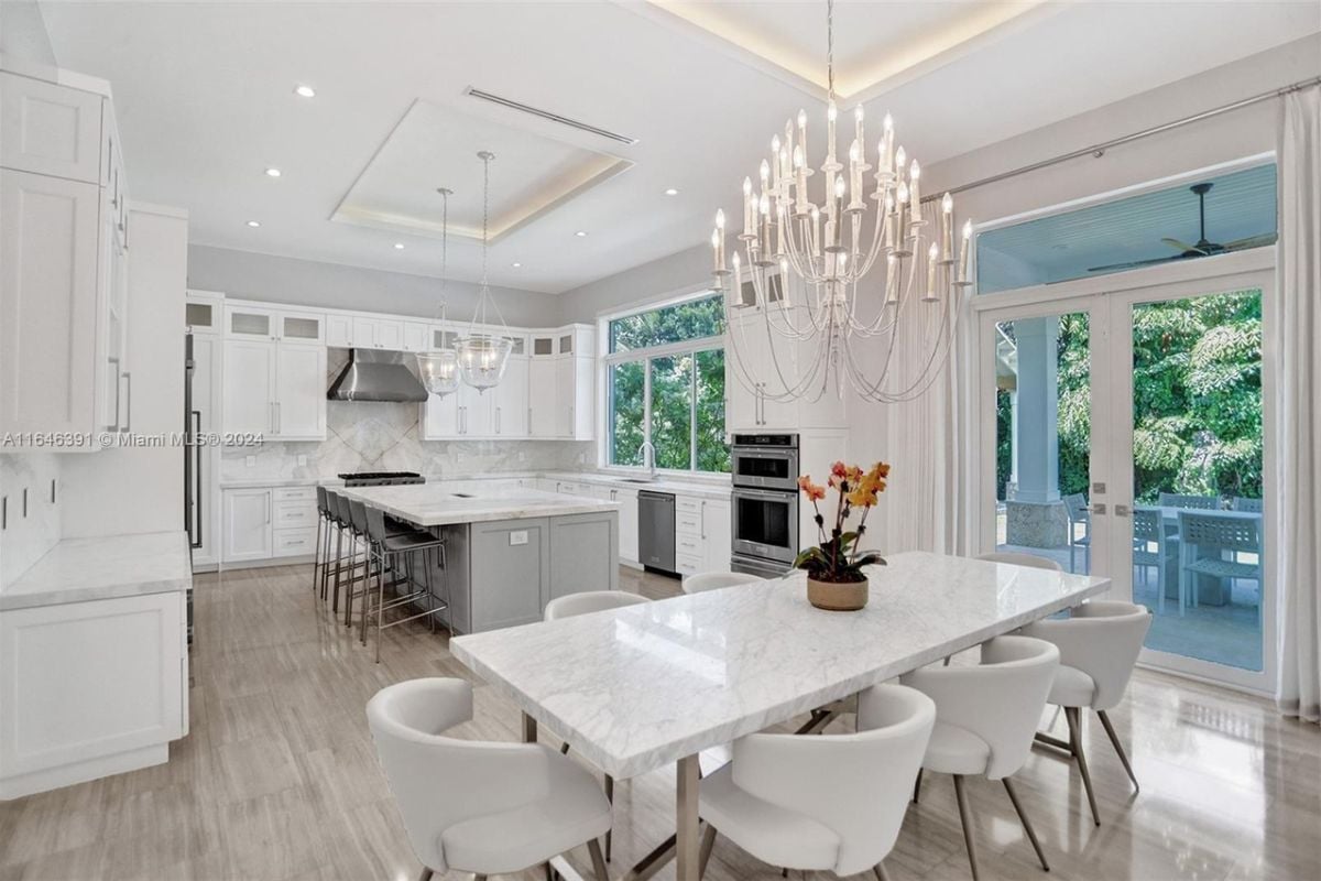 A great room with a dining area, and a kitchen.