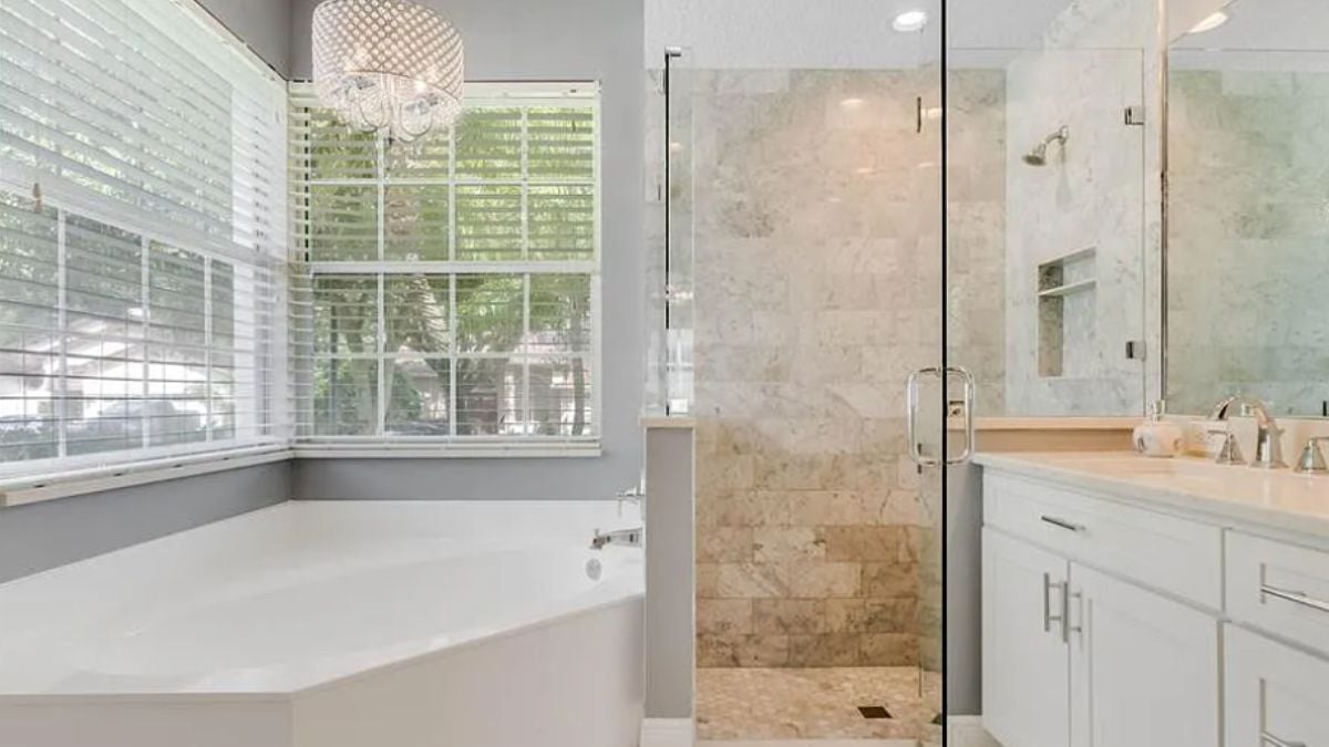 A bathroom with a vanity and a bathtub.