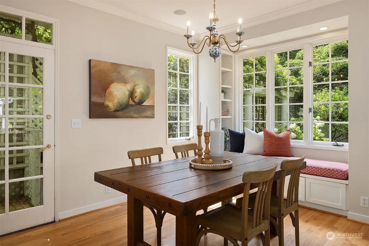 Breakfast nook with a wood table and chairs.