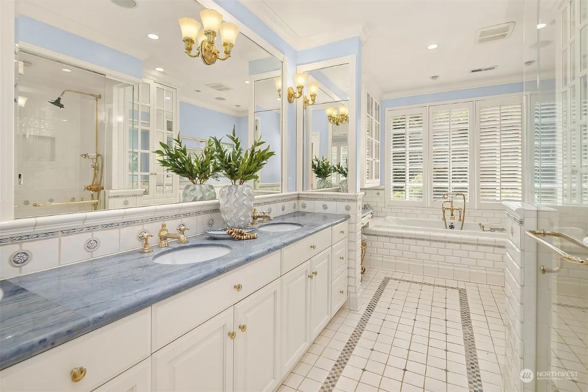 Bathroom with a custom-made vanity and a soaking tub.