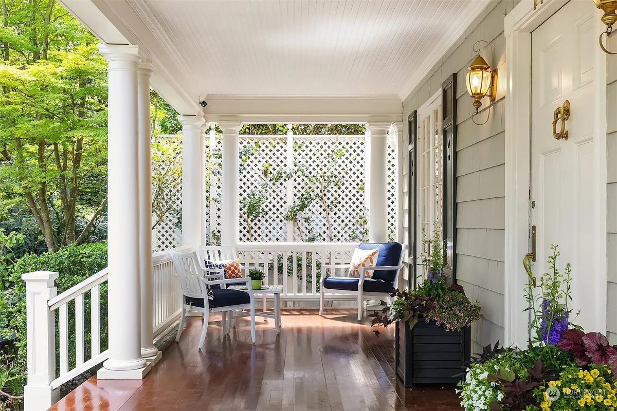 Porch with a table and chairs.