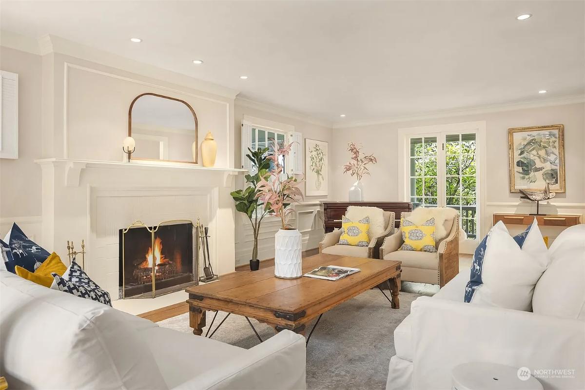 Living room with couches and a fireplace.